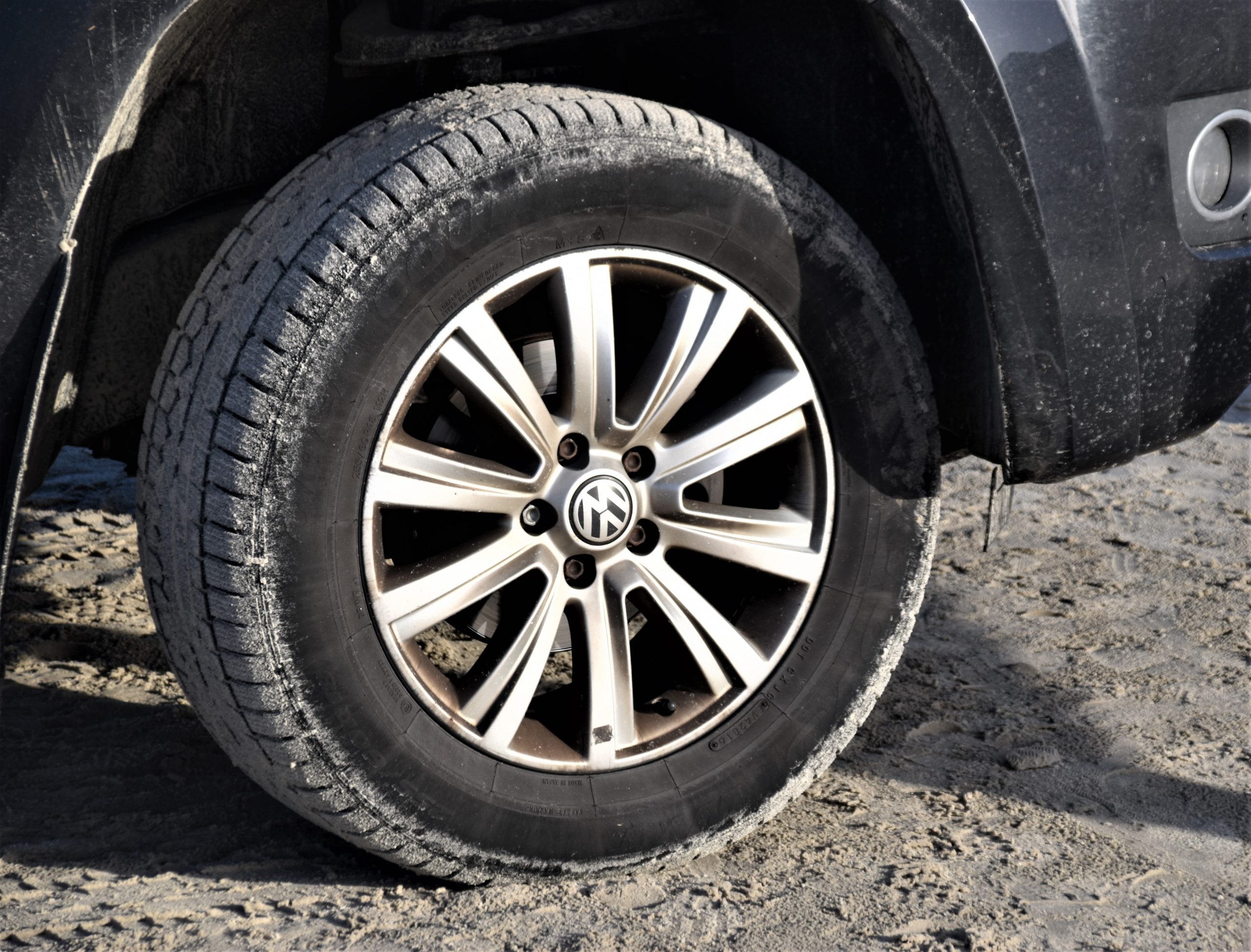 Closeup of older tire with dirt on it