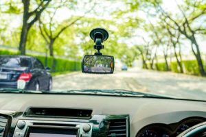 A view from the passenger seat of a car, showing a dashboard camera