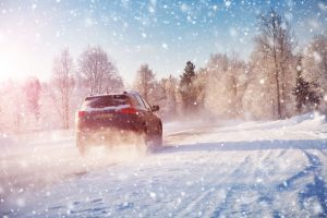 winter panorama on the road through coniferous forest