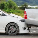 Car crash with car rear-ending truck