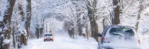 A car driving down a snow street