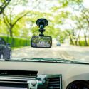 A view from the passenger seat of a car, showing a dashboard camera