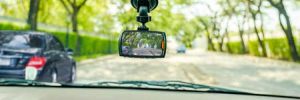 A view from the passenger seat of a car, showing a dashboard camera