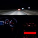View of a person driving on the highway at night