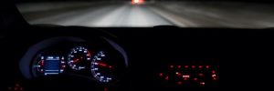 View of a person driving on the highway at night