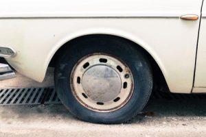 An old tire on a classic car