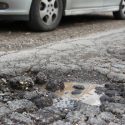 A pothole in the middle of a road