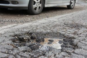 A pothole in the middle of a road