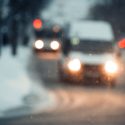 Blurred city at night. Bokeh. Beautiful abstract background with defocused buildings, cars, city lights, people. Colorful bokeh background with urban night scene. Design. Concept backdrop. Vintage