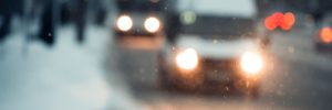 Blurred city at night. Bokeh. Beautiful abstract background with defocused buildings, cars, city lights, people. Colorful bokeh background with urban night scene. Design. Concept backdrop. Vintage