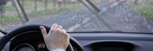 driver drives the car on a rainy day