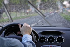 driver drives the car on a rainy day
